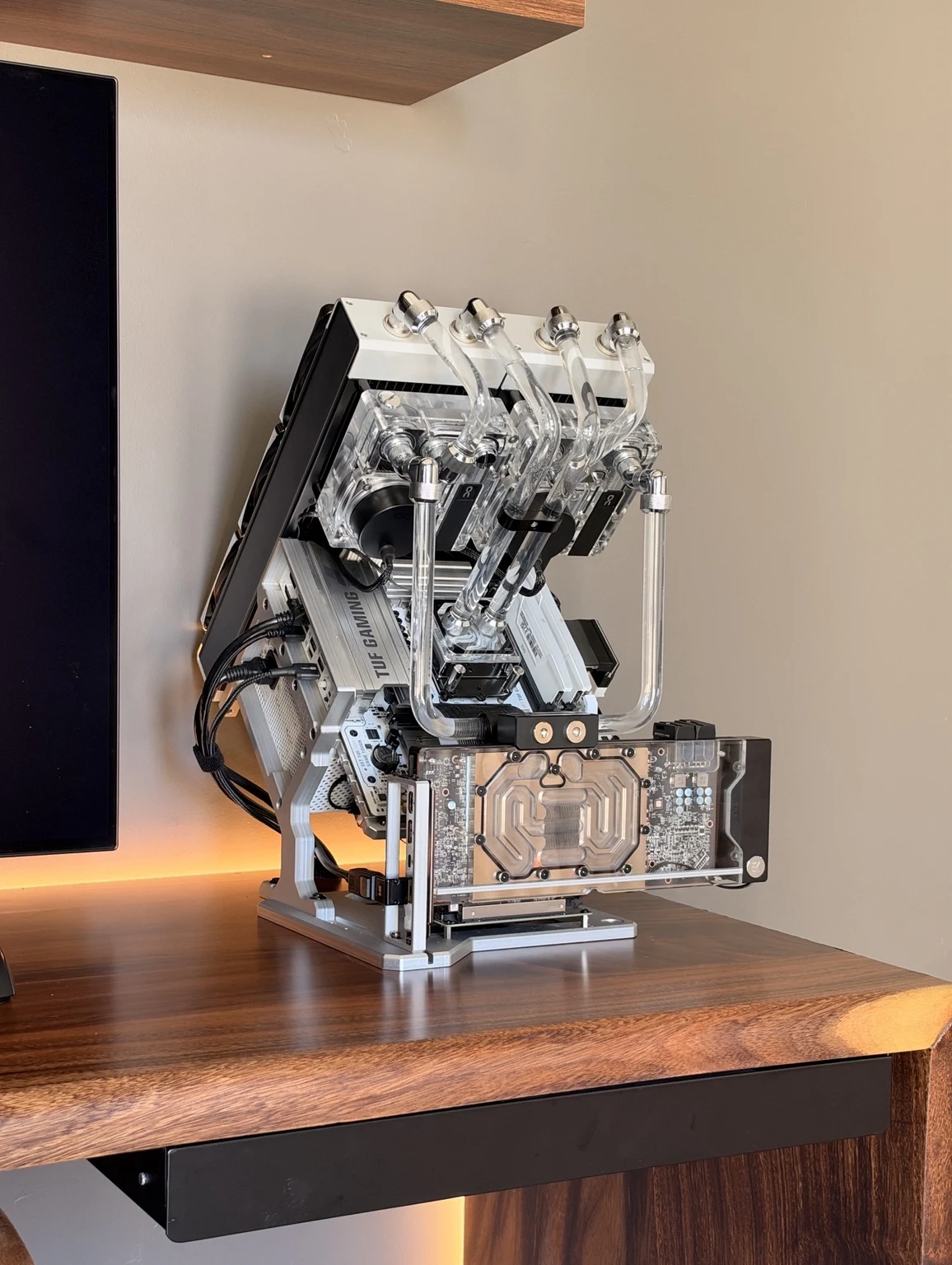 Silver angled A45 Max custom PC with visible tubing and water-cooled graphics card