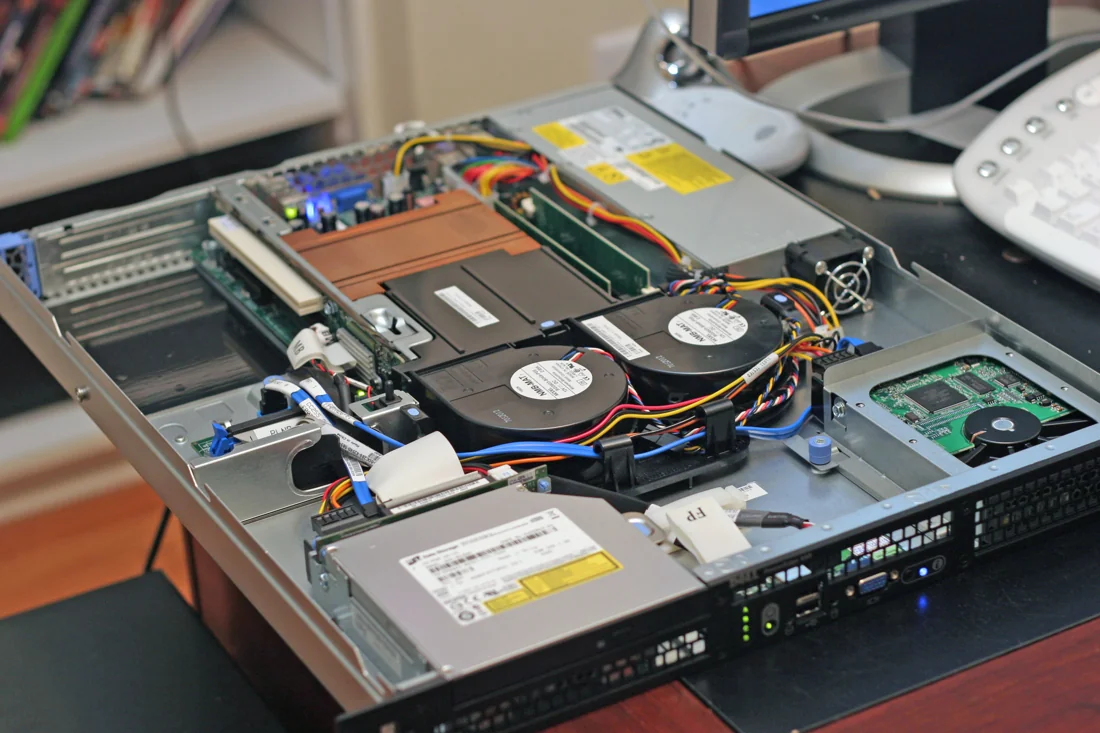 Dell PowerEdge 850 with its lid removed, revealing motherboard, fans and internal drive connections